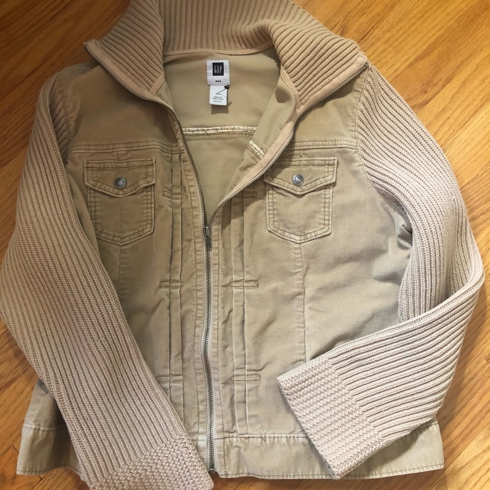 Tan corduroy zip jacket. Knit sweater arms and collar. Two upper snap pockets.